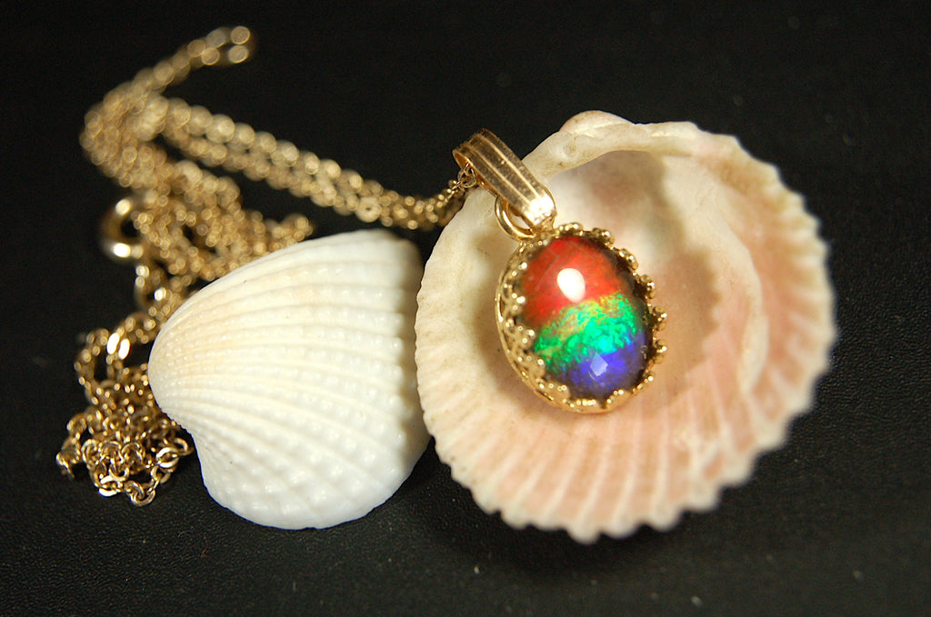 Gorgeous Ammolite pendant in 14k gold.Petite but powerful.Four color ammolite.Ammolite jewelry from Canada.Perfect gift. .060212