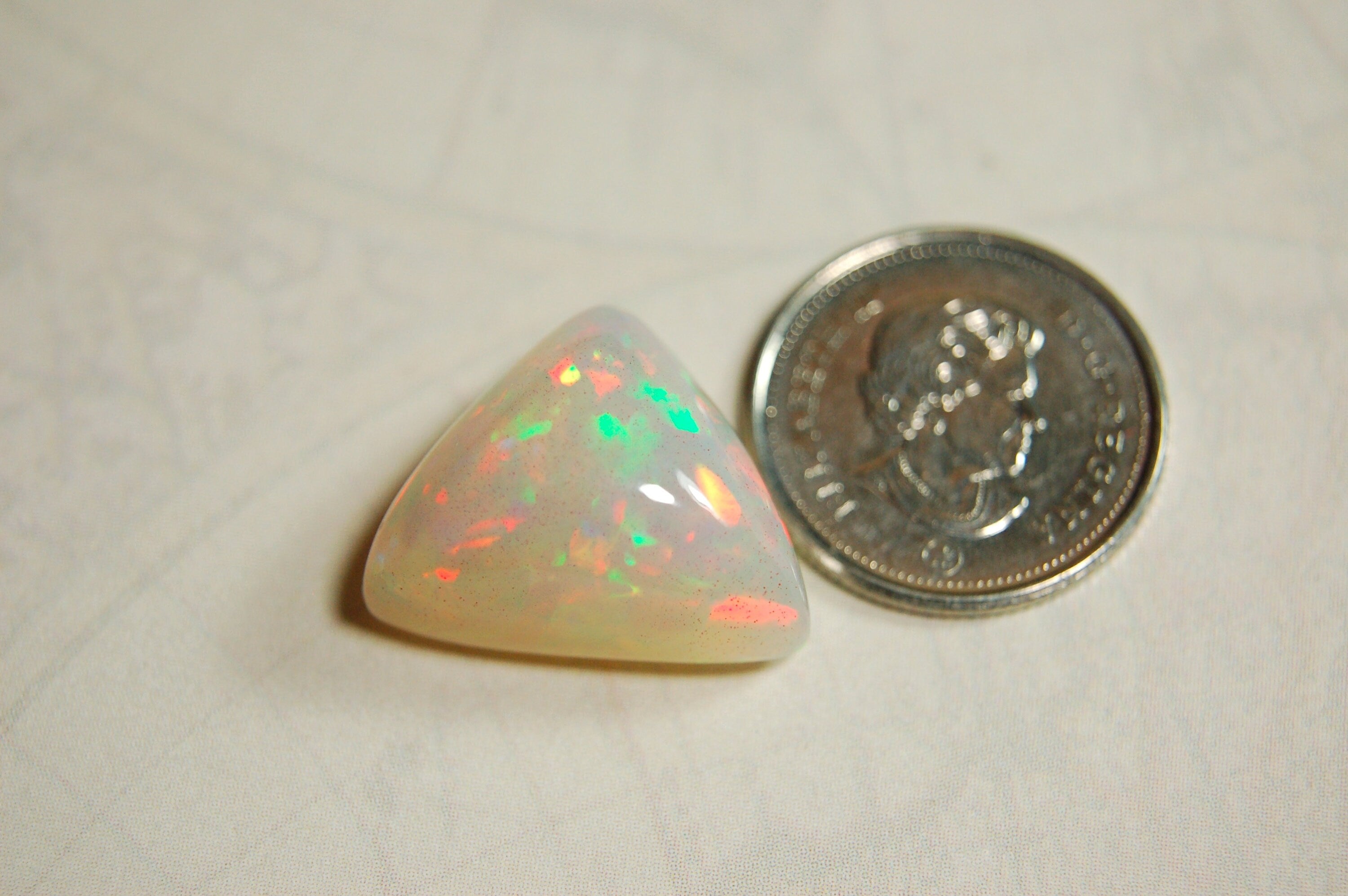 Large genuine natural Opal Cabochon from Ethiopia.11 Carat beauty with many bright colors.Best viewed in video--better in hand.122813