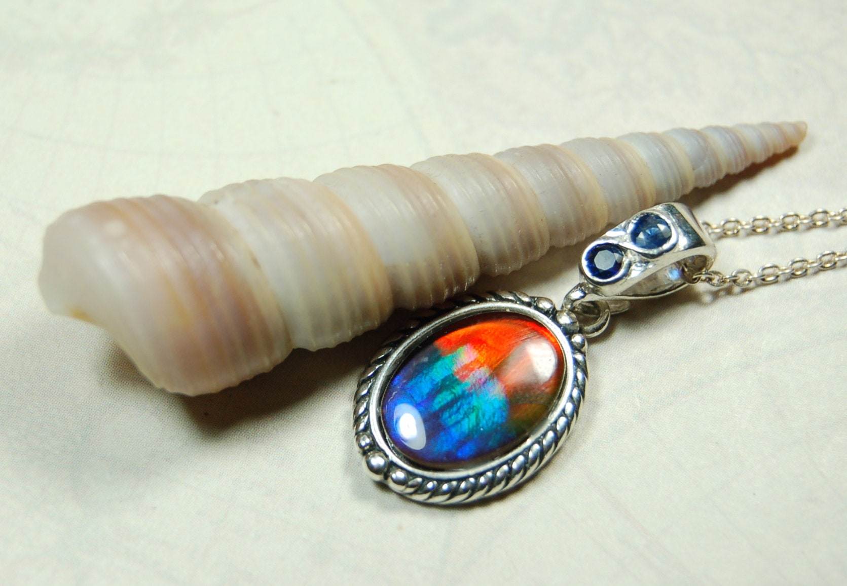 Ammolite Pendant Necklace.Solid sterling silver setting.Bright Rainbow colors. Sapphire studded bail.Unique gift for wife.102429