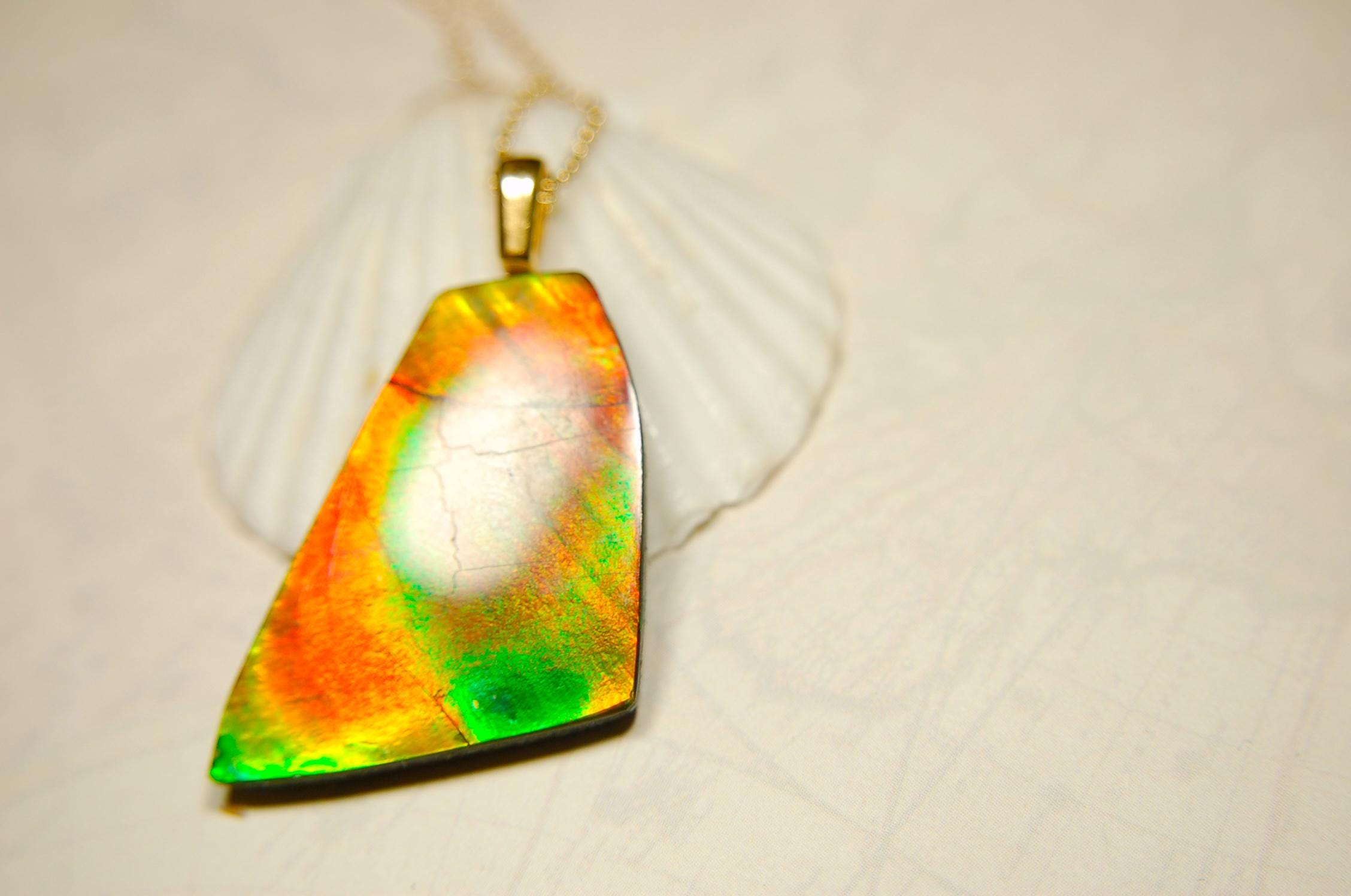 Ammolite Pendant.Natural Cabochon with strong color changing abilities.14kGF Gold bail.Elevate your style.030716