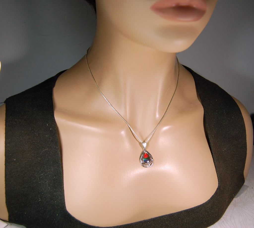 Eye-Catching Ammolite Pendant gift for Mothers Day she will treasure.Genuine Ammolite mined, finished and shipped from Canada 032015