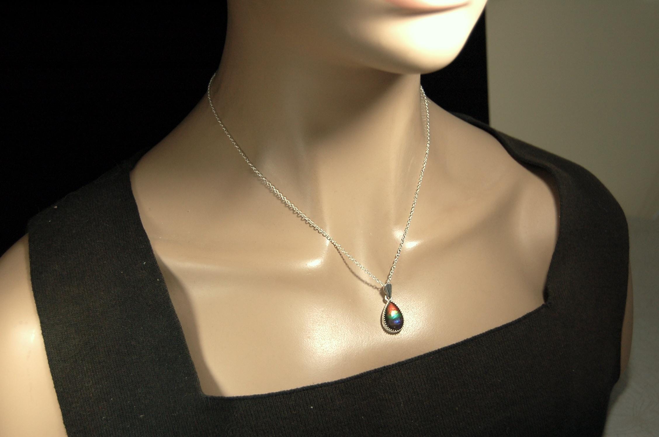 Dainty ammolite pendant.Brilliant color gem.Feminine jewelry.UniqueGift for her.Canadian gemstone.Sterling Silver setting.021126