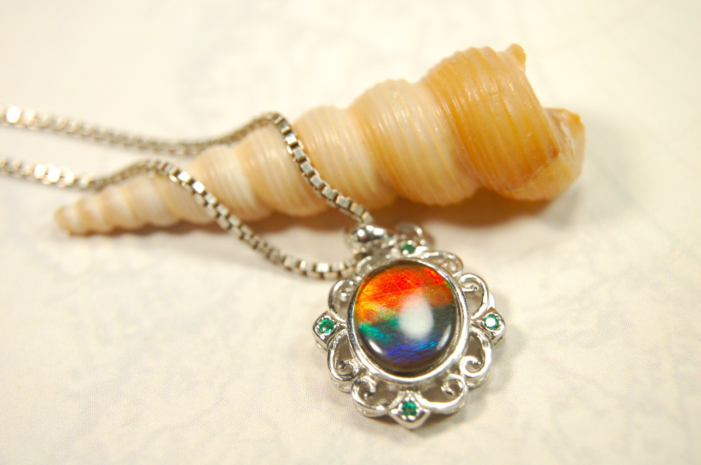 Ammolite Jewelry Pendant.Certified Authentic Canadian gem.White Gold Fill over Sterling silver setting.120213