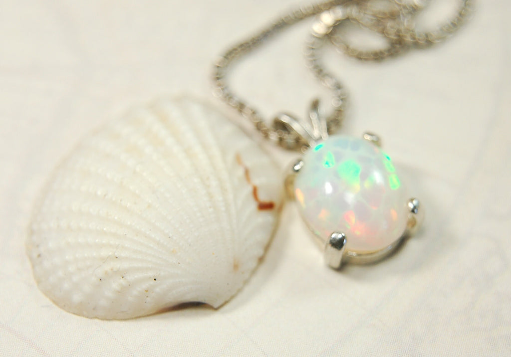 Opal pendant.Bright rolling colors. Desirable honeycomb gemstone.Perfect gift for her.MUST see colors in video.121213