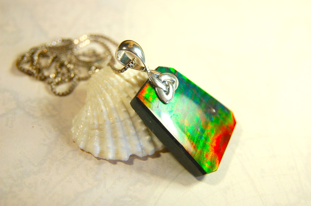 Natural Ammolite Cabochon Pendant necklace with deep rich colors.Heavy sterling silver Celtic Bail.Gift for wife? Must see video.032514