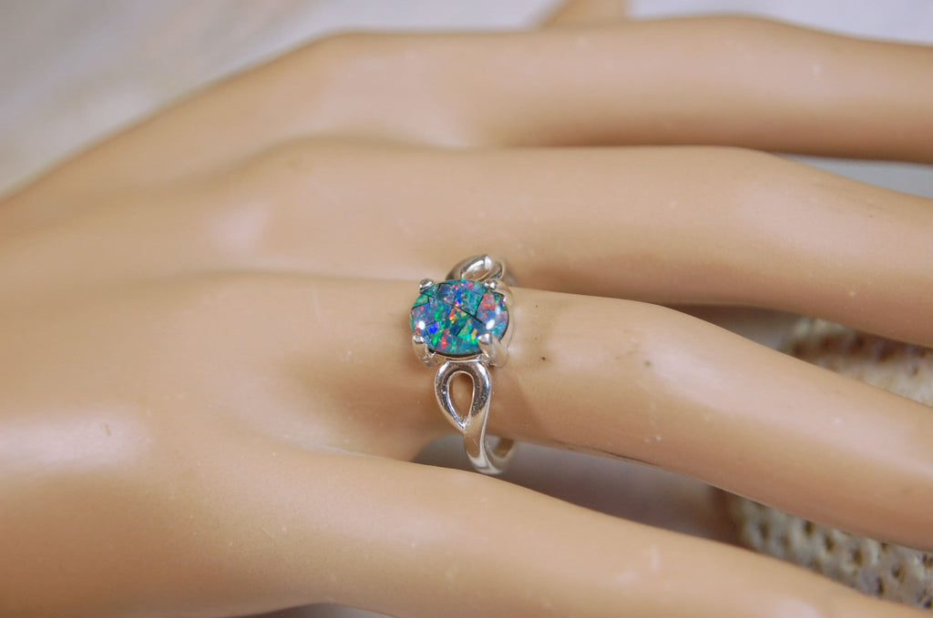 Australian Opal Ring.Gorgeous colors. Set in Sterling Silver.The perfect gift.Size 7 Boho style.