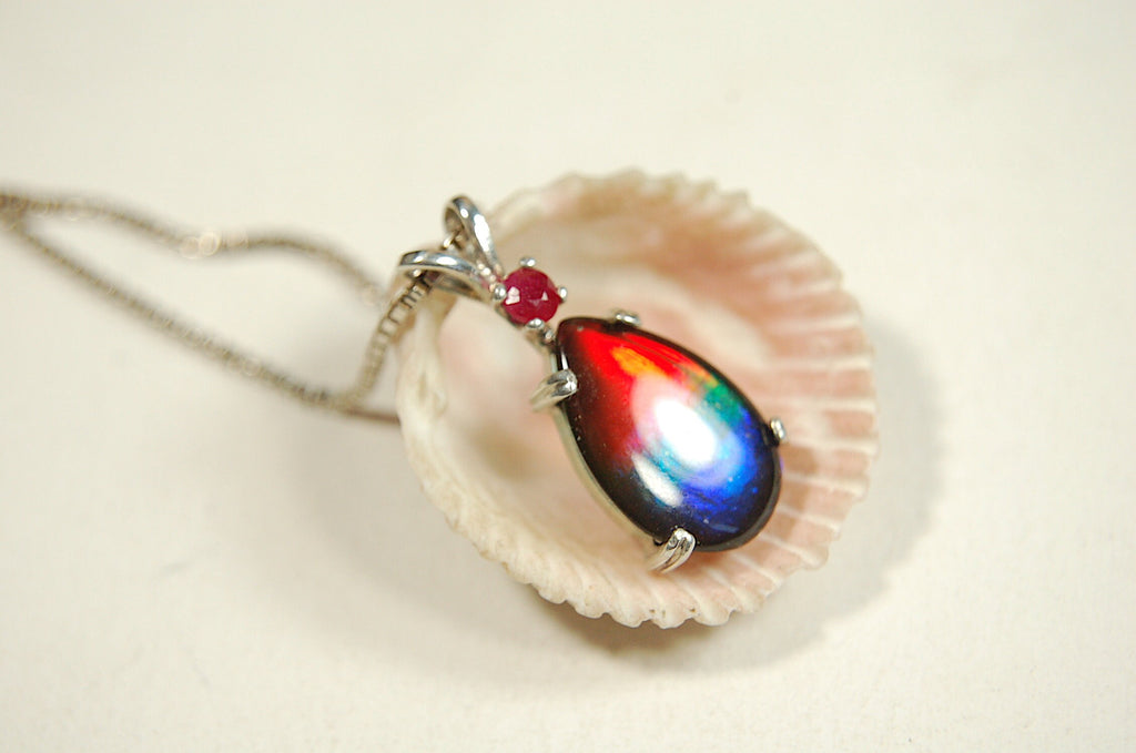 Ammolite Raibow pendant.Natural ruby companion stone.Lots of bright colors.#110317