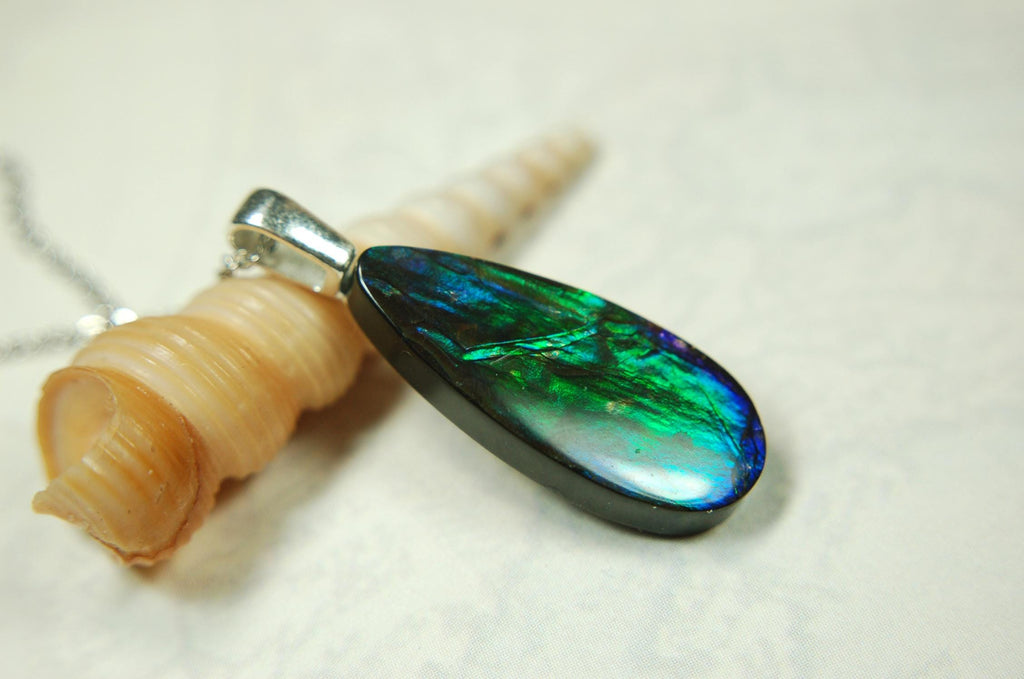 Ammolite Jewelry Pendant.All natural high quality cabochon from Alberta Canada.070715