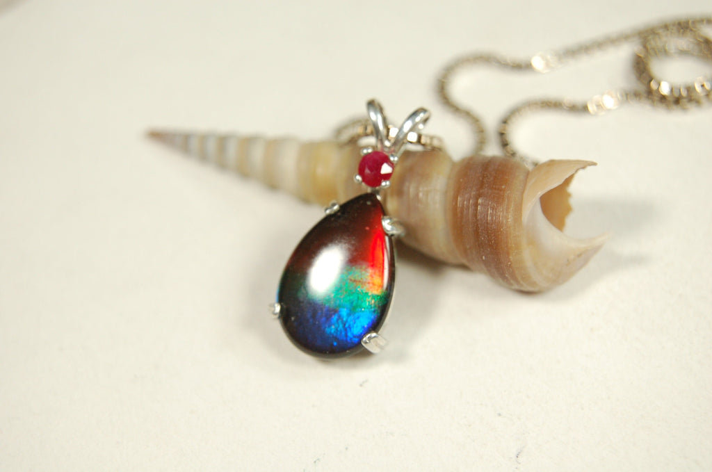Ammolite Raibow pendant.Natural ruby companion stone.Lots of bright colors.#110317