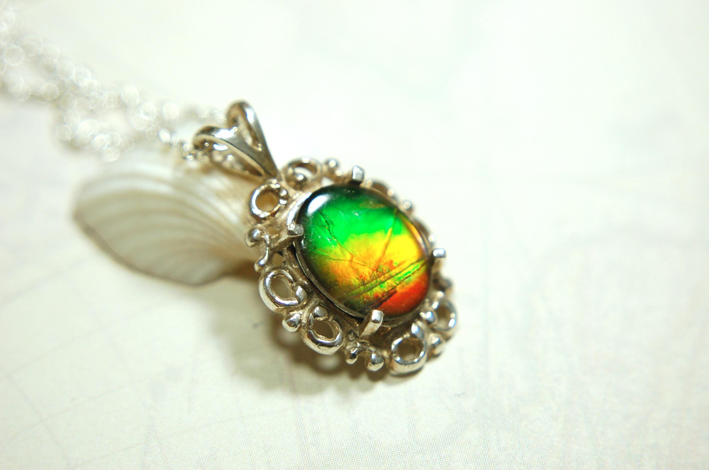 Ammolite pendant petite but powerful impact.Rich Sunset colors.Memorable gift.Fashion accessory.Rare jewelry.022216