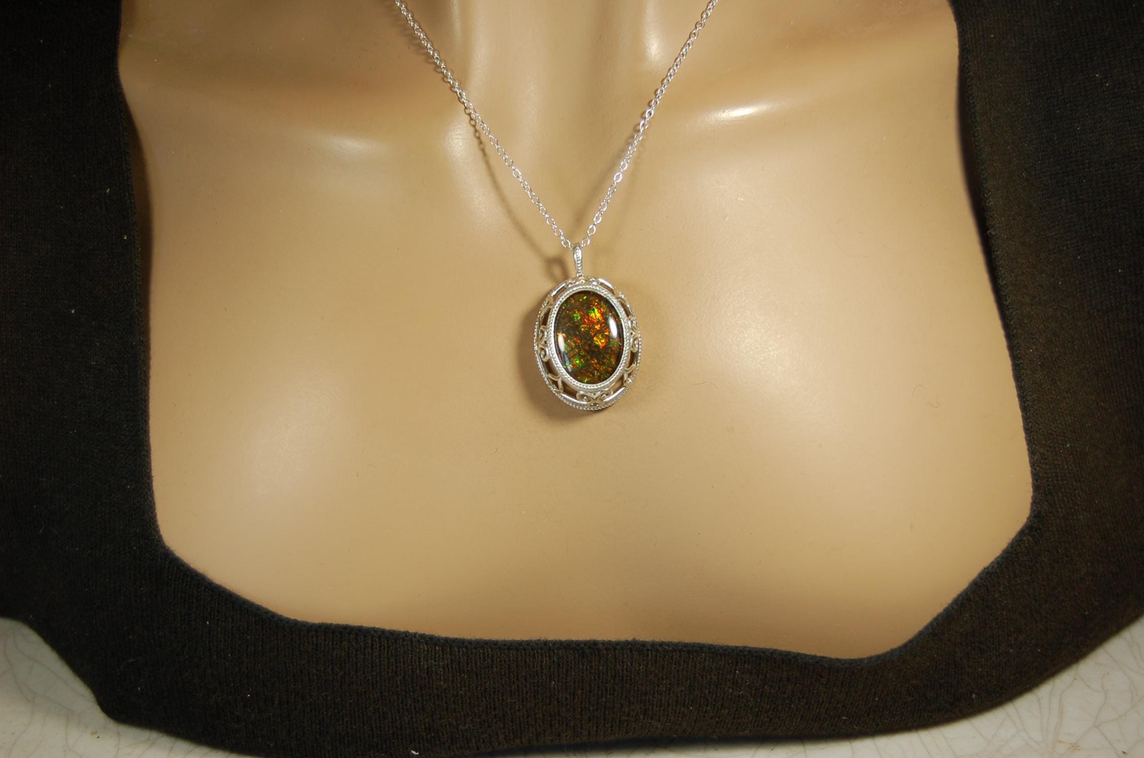 Unusual Ammolite pendant full of multicolor sparkles.A gift that will be treasured..032116
