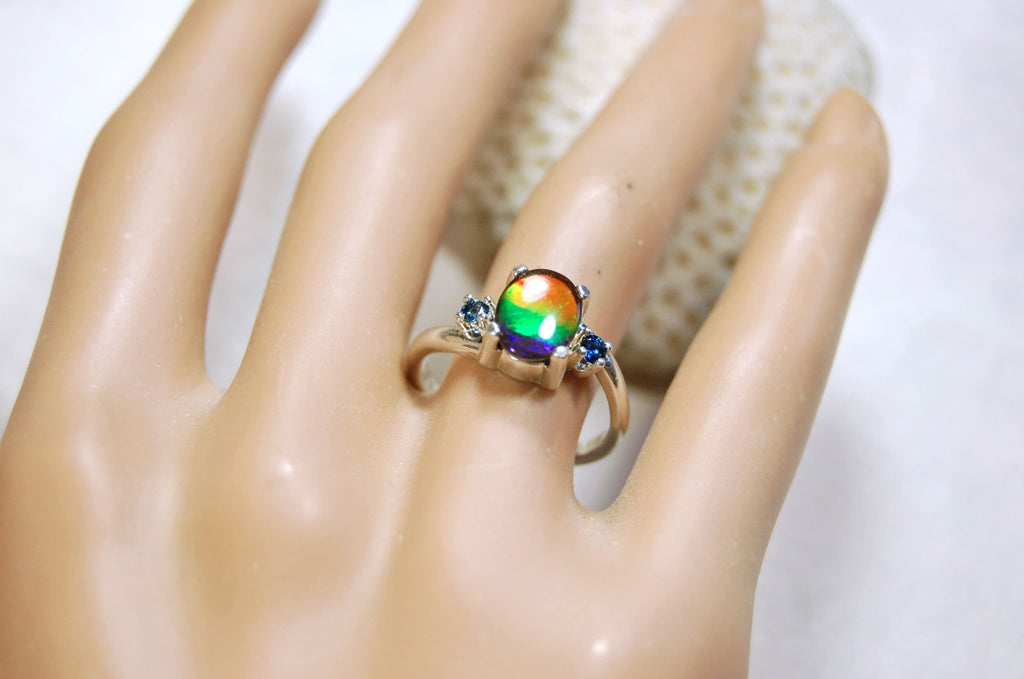 Ammolite Ring with Sapphire side stones.Lovely four color gem.Size 7.-#040314