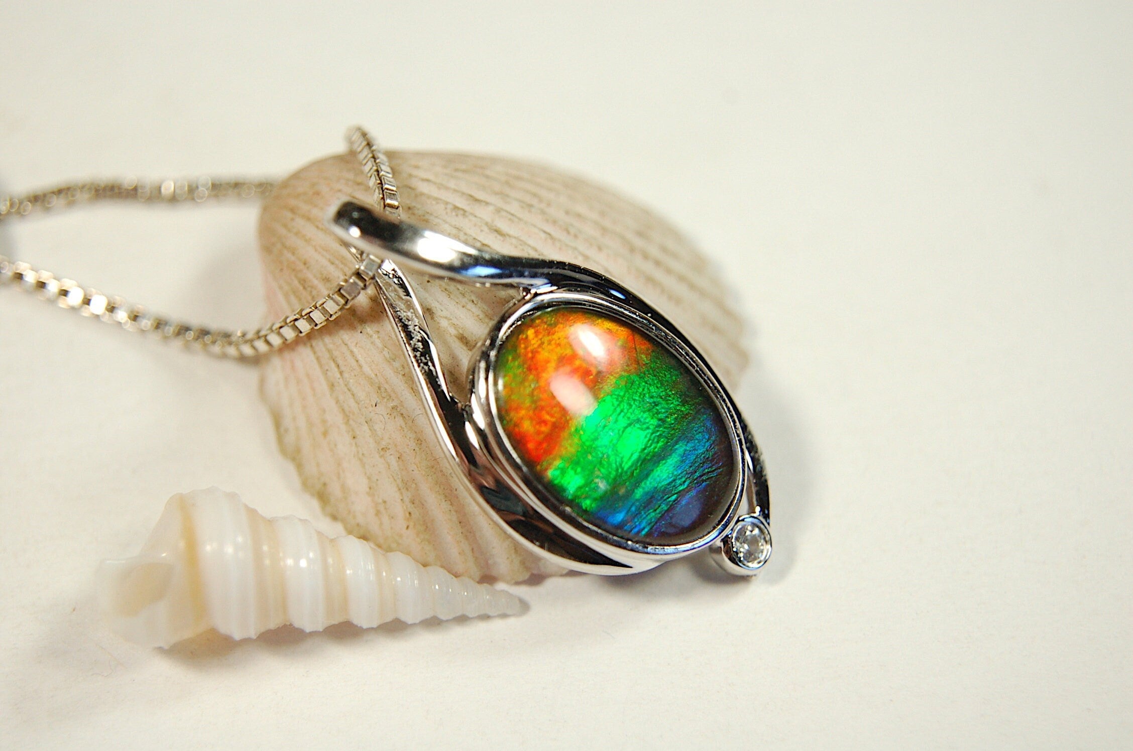 Ammolite Jewelry Pendant.Strong colors.Quality sterling Allergy free silver setting.Shipped free.071612