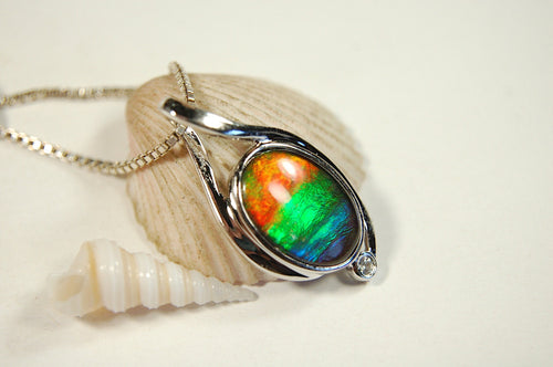 Ammolite Jewelry Pendant.Strong colors.Quality sterling Allergy free silver setting.Shipped free.071612