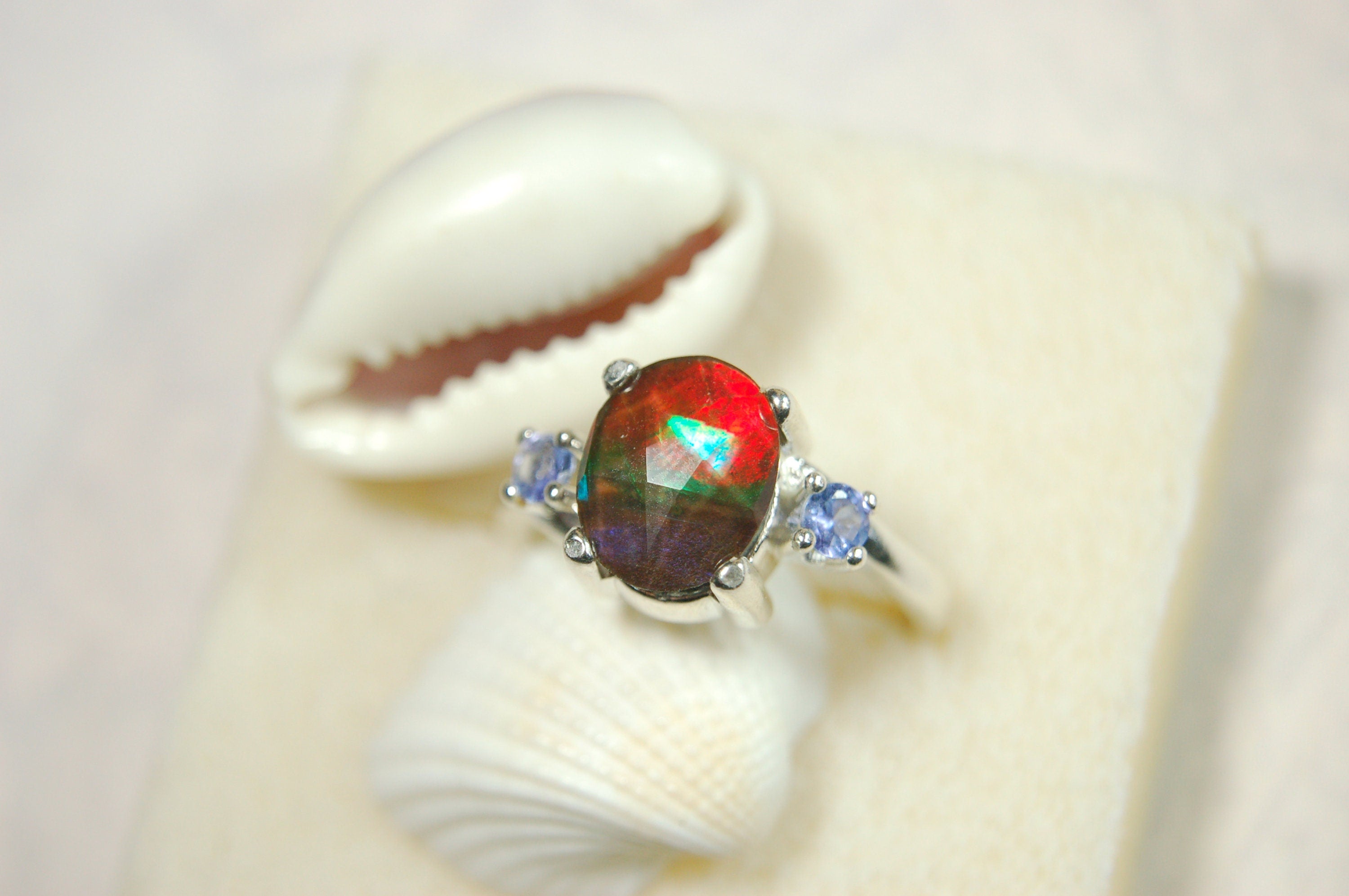Ammolite Jewelry Ring with Tanzanites.No import taxes under CUSMA rules.022414
