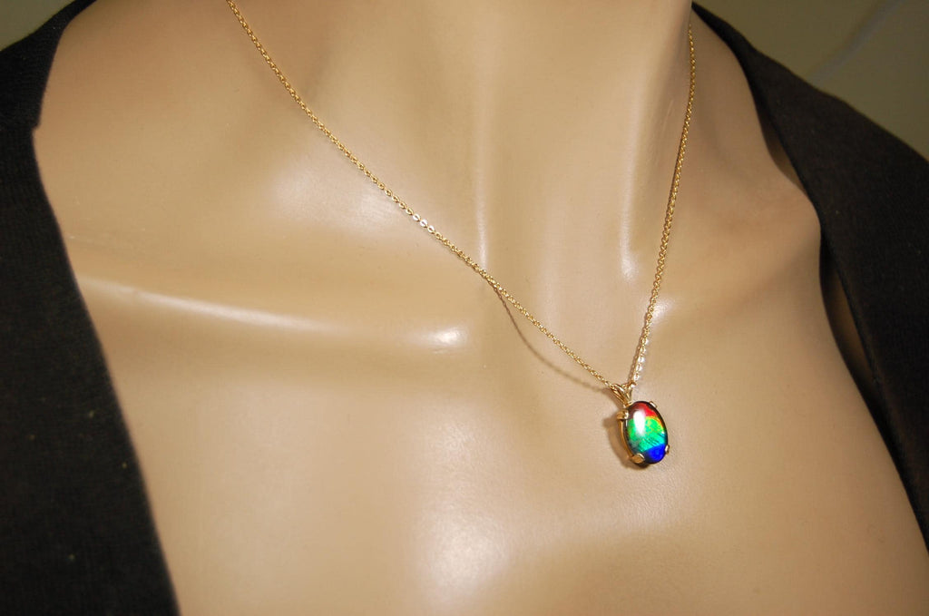 Ammolite necklace pendant in solid 10k yellow gold.A gift your wife will treasure.Brilliant color changer. 071601