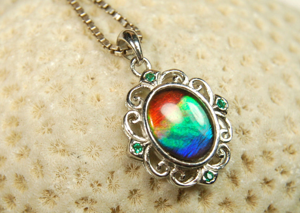 Ammolite Jewelry Pendant.Certified Authentic Canadian gem.White Gold Fill over Sterling silver setting.120213