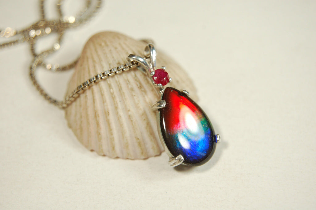 Ammolite Raibow pendant.Natural ruby companion stone.Lots of bright colors.#110317