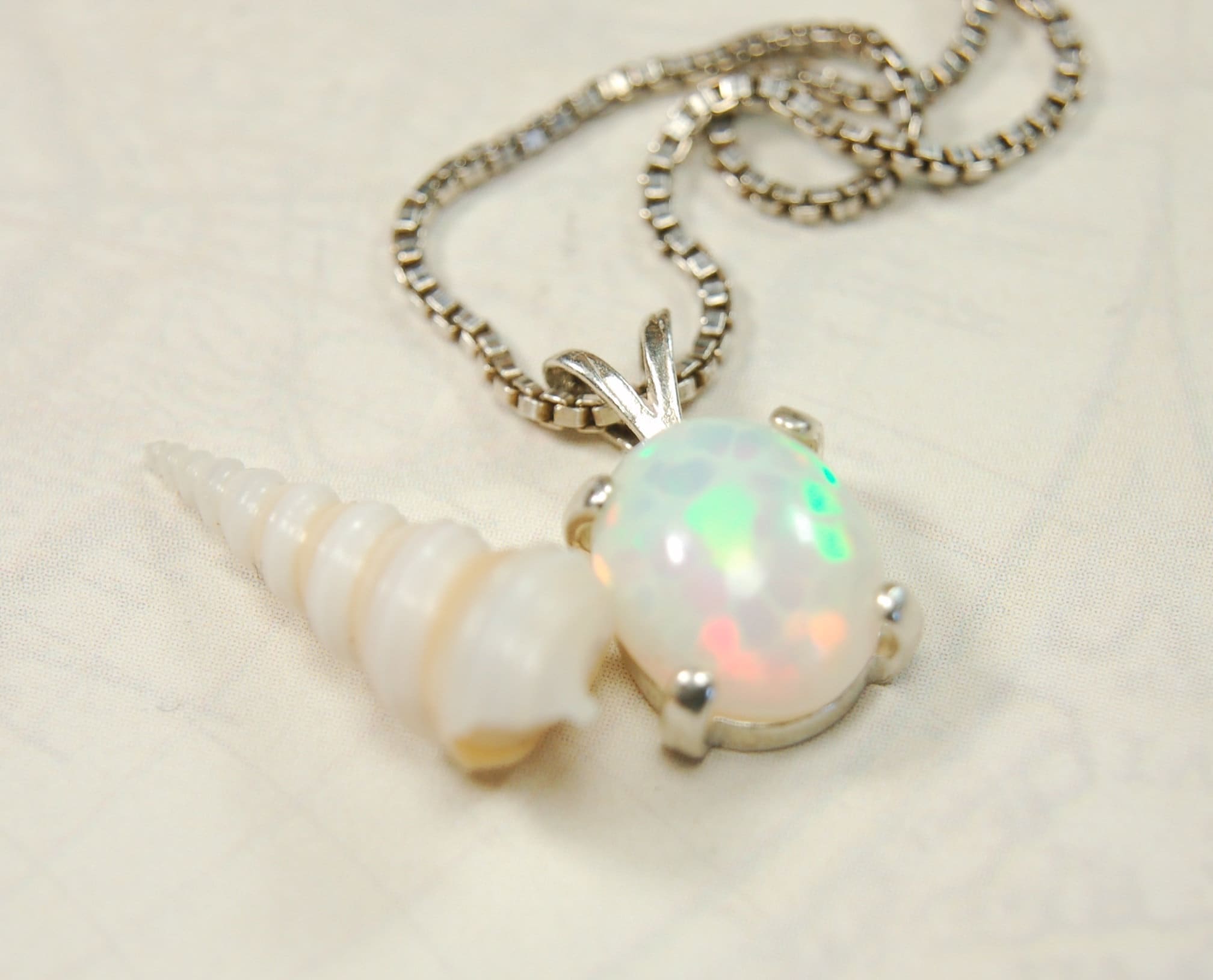 Opal pendant.Bright rolling colors. Desirable honeycomb gemstone.Perfect gift for her.MUST see colors in video.121213