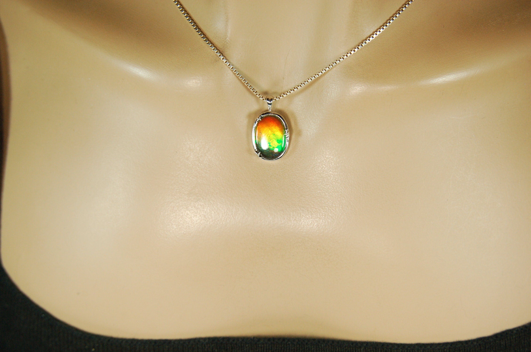 Ammolite Jewelry pendant with lovely rich colors that amaze.Canadian ammolite.Ammolite jewelry at its best.Ammolite from Canada.#051012