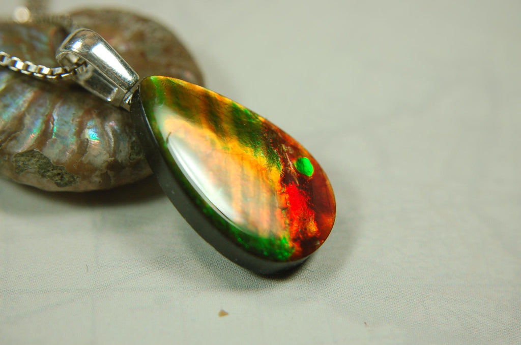 Anniversary gift idea.Unisex Jewelry.Ammolite Pendant Necklace, Sterling Silver Feather Bail. Color changing natural freeform cabochon.
