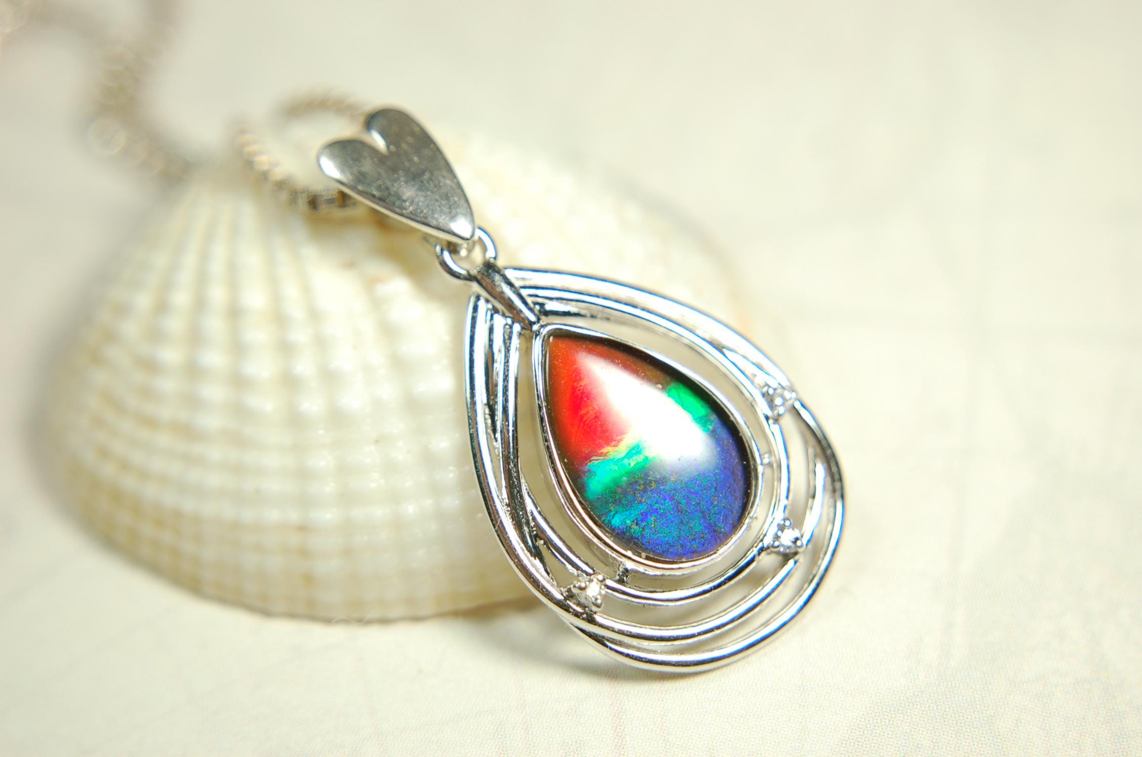 Eye-Catching Ammolite Pendant gift for Mothers Day she will treasure.Genuine Ammolite mined, finished and shipped from Canada 032015