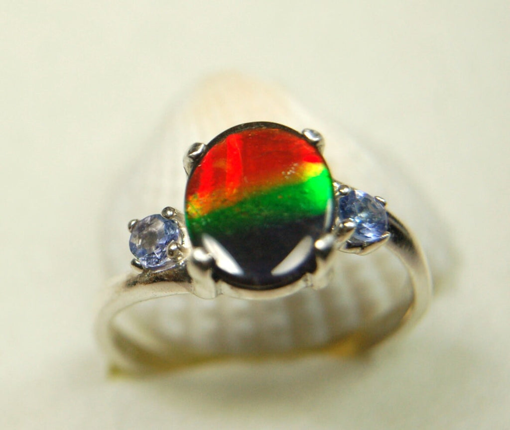 Ammolite Ring with brilliant colors and Tanzanite side stones.Size 7 #120223