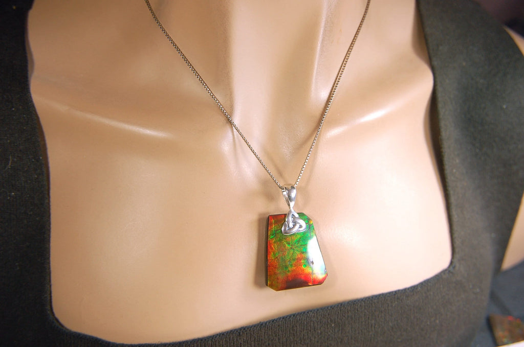 Natural Ammolite Cabochon Pendant necklace with deep rich colors.Heavy sterling silver Celtic Bail.Gift for wife? Must see video.032514