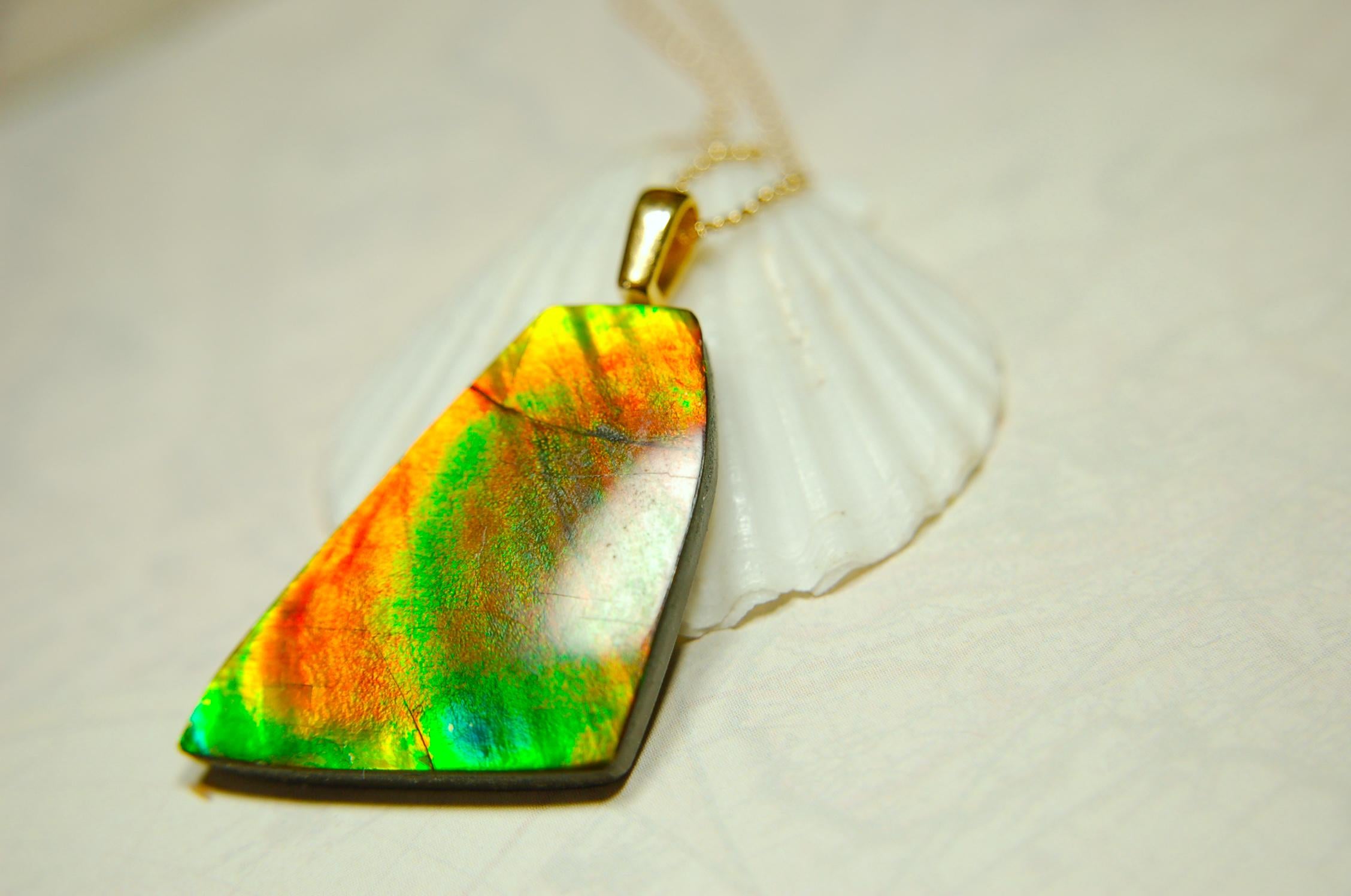 Ammolite Pendant.Natural Cabochon with strong color changing abilities.14kGF Gold bail.Elevate your style.030716