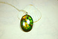 Ammolite cabochon pendant to upgrade your fashion accessory collection.Green and Copper colors.Sterling silver bail.Birthday gift? 032716