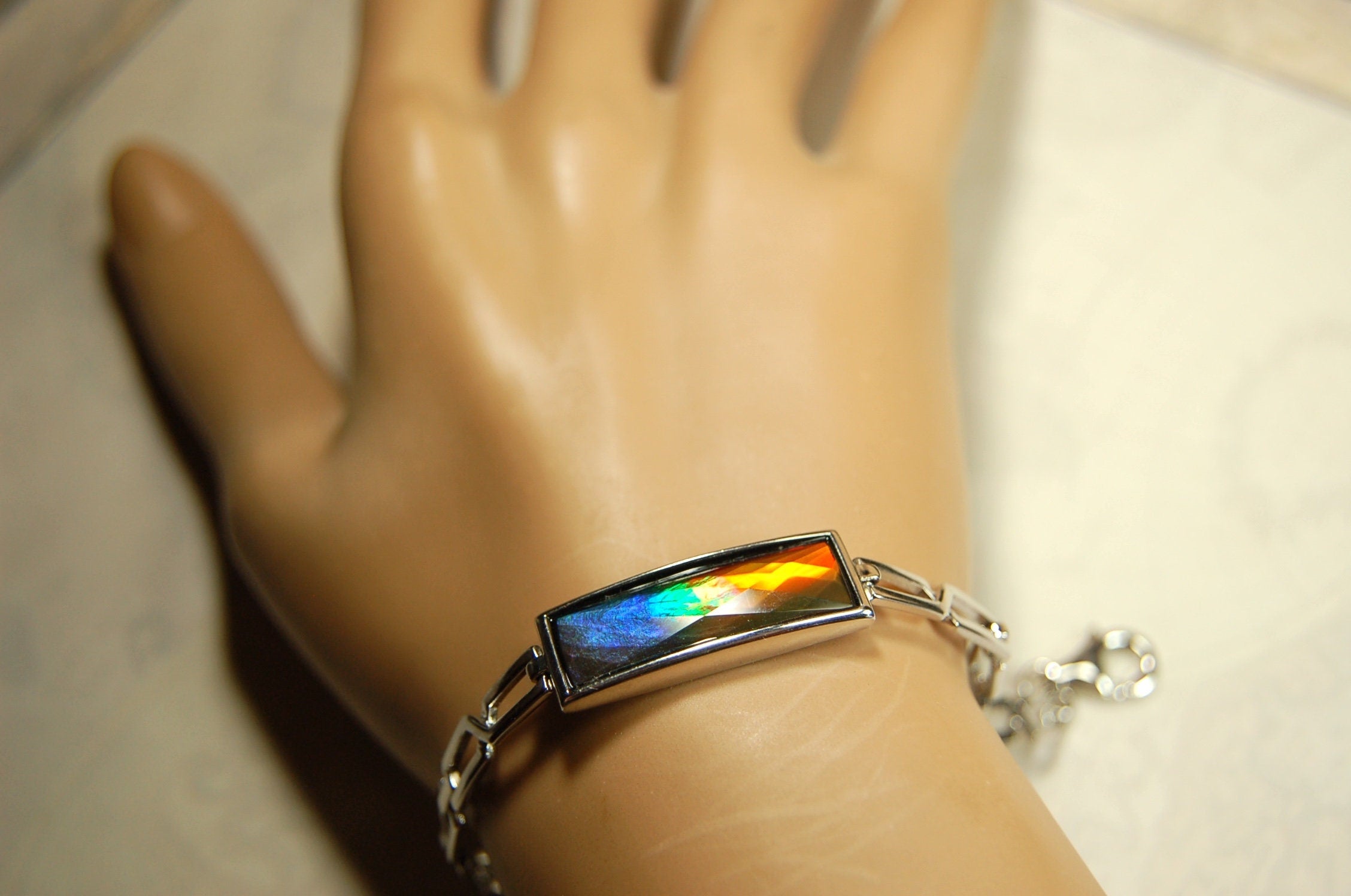 Ammolite Jewelry bracelet.Bright faceted gem shipped free.No import tax to US under CUSMA exemption #070614