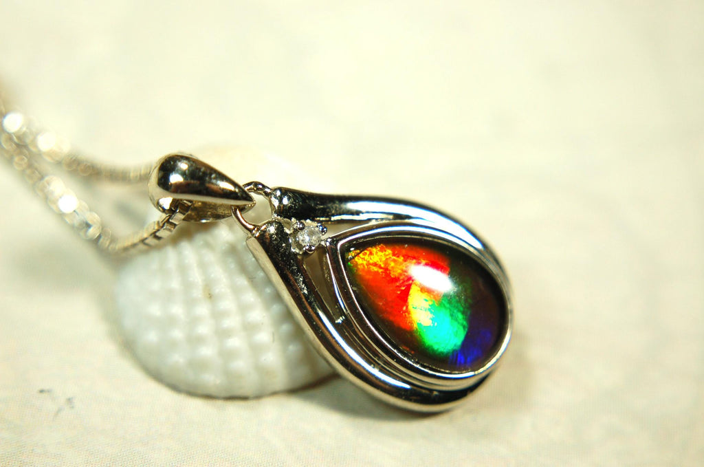 Buy Canadian Ammolite Pendant.Petite but very powerful colors.Perfect gift or gift for wife.Brilliant rainbow colors.Must see video.050429