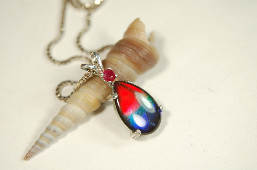 Ammolite Raibow pendant.Natural ruby companion stone.Lots of bright colors.#110317