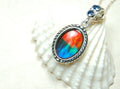 Ammolite Pendant Necklace.Solid sterling silver setting.Bright Rainbow colors. Sapphire studded bail.Unique gift for wife.102429