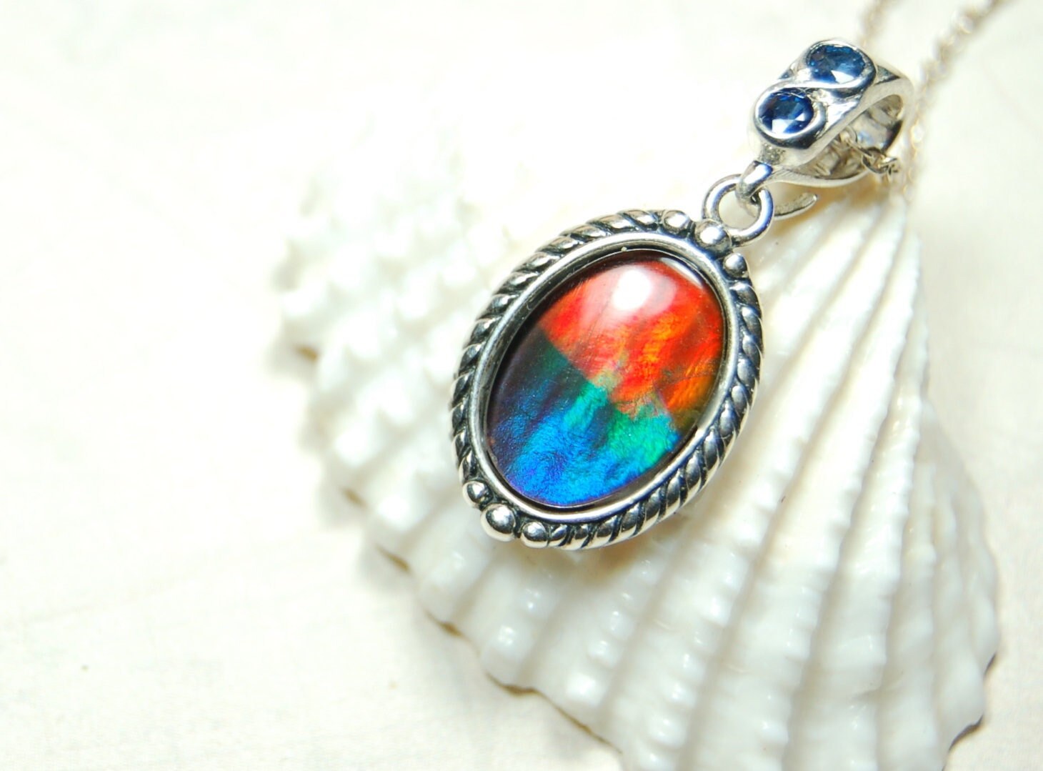 Ammolite Pendant Necklace.Solid sterling silver setting.Bright Rainbow colors. Sapphire studded bail.Unique gift for wife.102429