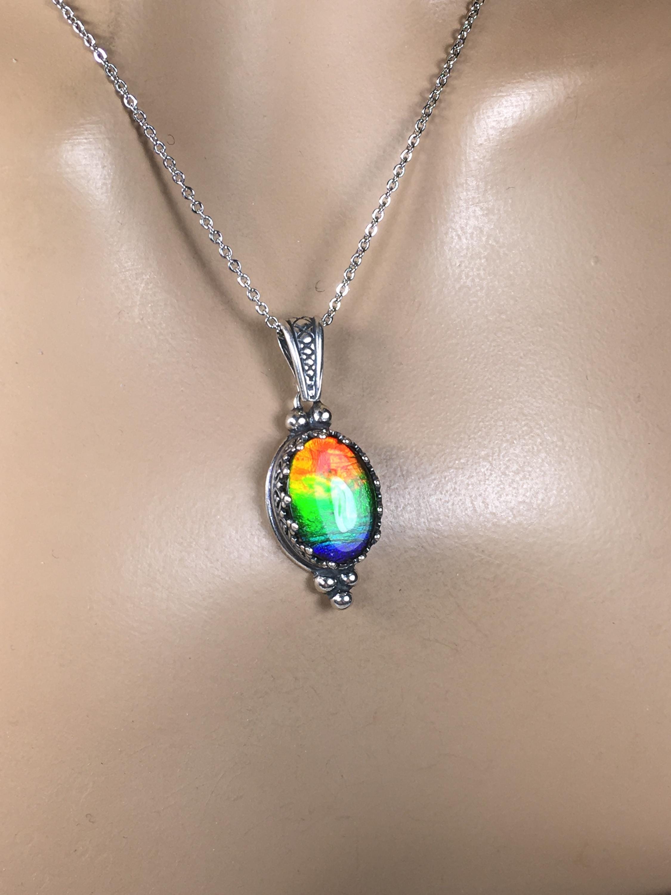 Genuine Ammolite Jewelry Pendant.Rainbow gem.Sterling Silver setting.No import taxes under CUSMA rules.062815