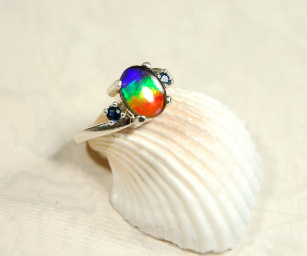 Ammolite Ring with Sapphire side stones.Lovely four color gem.Size 7.-#040314