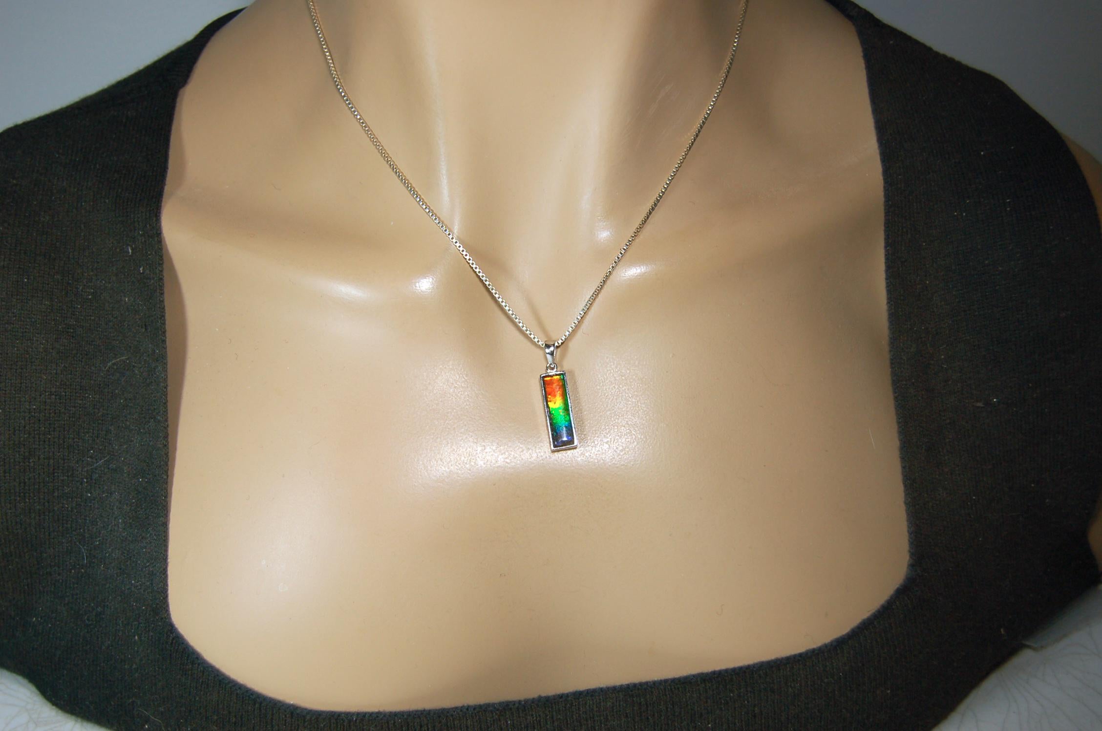 Lovely Ammolite pendant - the perfect gift for someone special.Sterling Silver plated with Rhodium so allergy free.052415