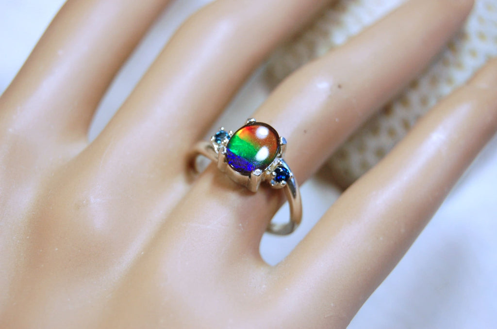Ammolite Ring with Sapphire side stones.Lovely four color gem.Size 7.-#040314