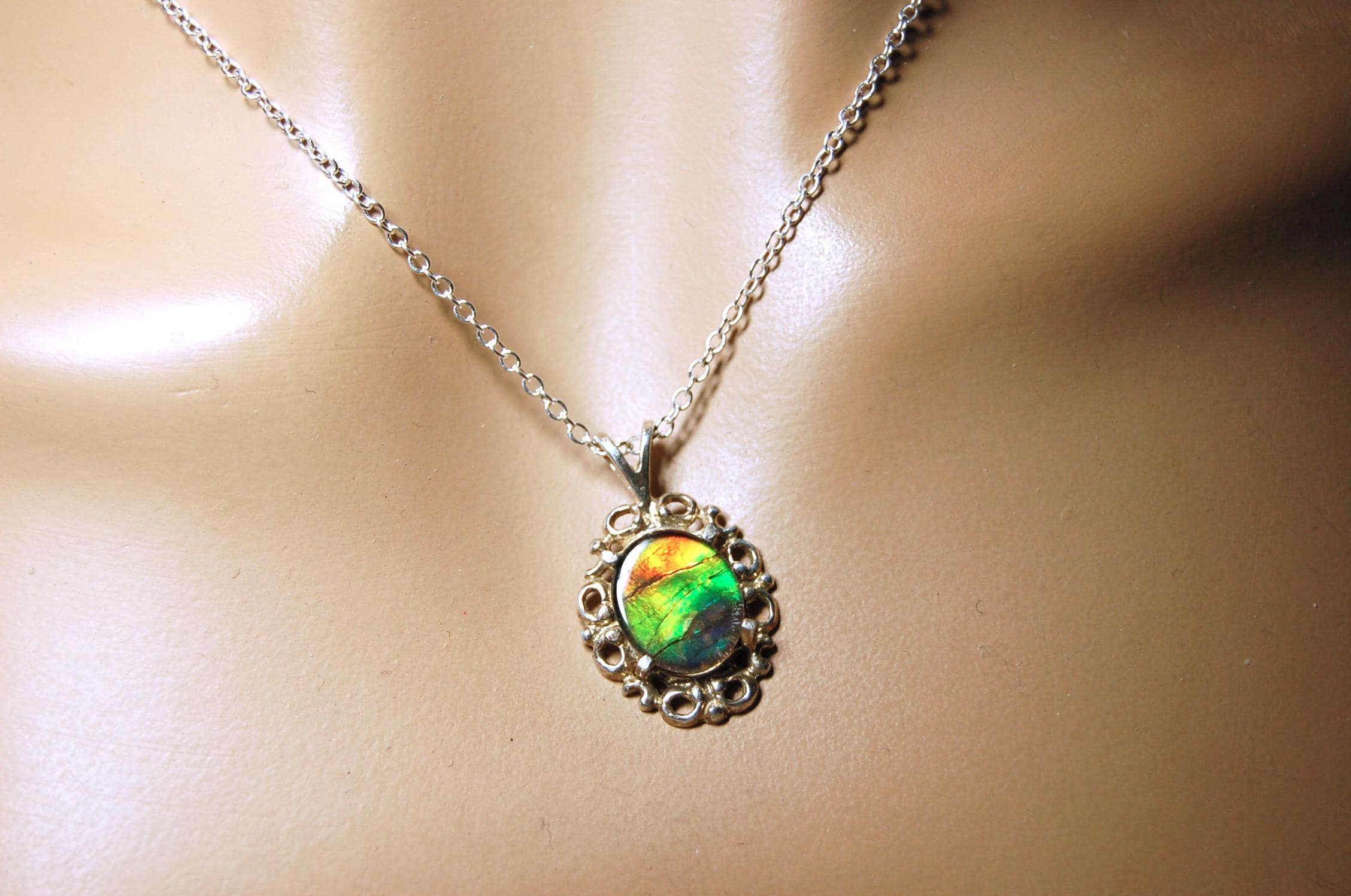 Ammolite Pendant from Alberta Canada.Genuine quality ammolite with warranty.The perfect gift.010926