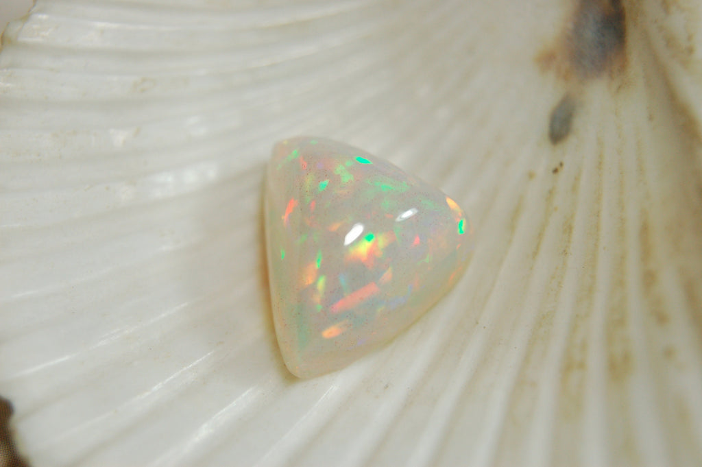 Large genuine natural Opal Cabochon from Ethiopia.11 Carat beauty with many bright colors.Best viewed in video--better in hand.122813