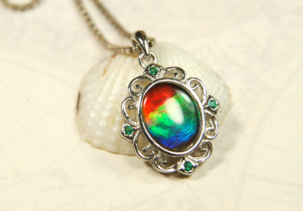 Ammolite Jewelry Pendant.Certified Authentic Canadian gem.White Gold Fill over Sterling silver setting.120213
