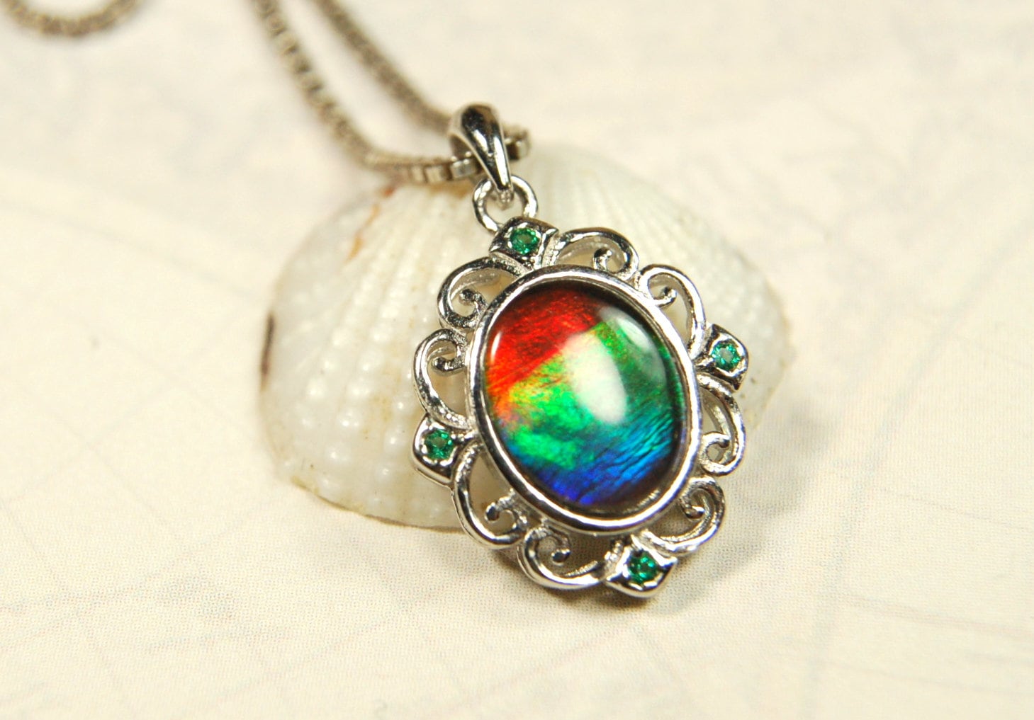 Ammolite Jewelry Pendant.Certified Authentic Canadian gem.White Gold Fill over Sterling silver setting.120213