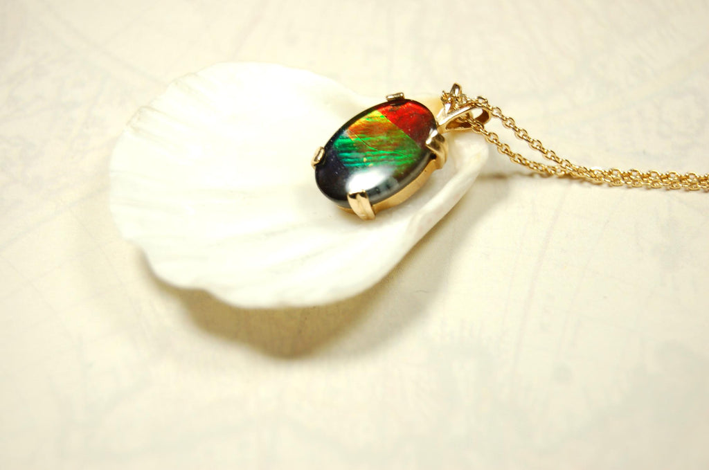 Ammolite necklace pendant in solid 10k yellow gold.A gift your wife will treasure.Brilliant color changer. 071601