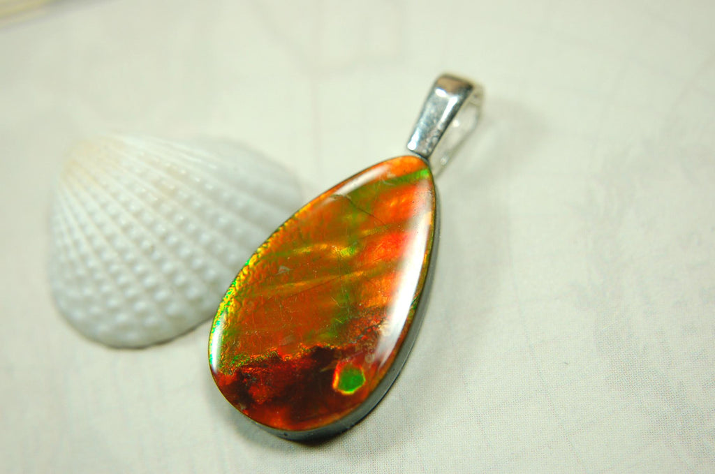 Anniversary gift idea.Unisex Jewelry.Ammolite Pendant Necklace, Sterling Silver Feather Bail. Color changing natural freeform cabochon.