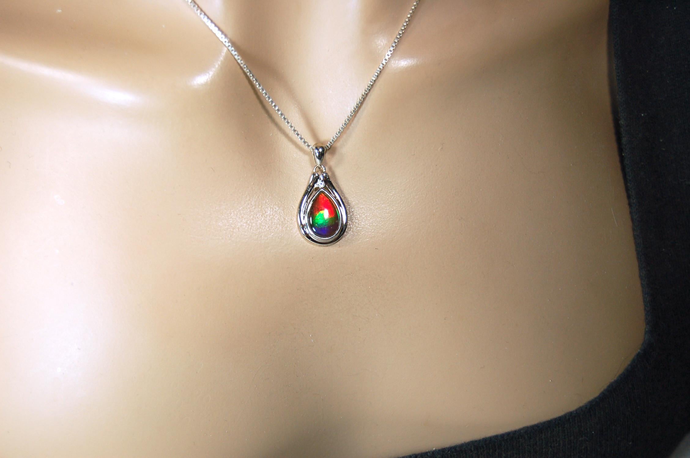 Buy Canadian Ammolite Pendant.Petite but very powerful colors.Perfect gift or gift for wife.Brilliant rainbow colors.Must see video.050429