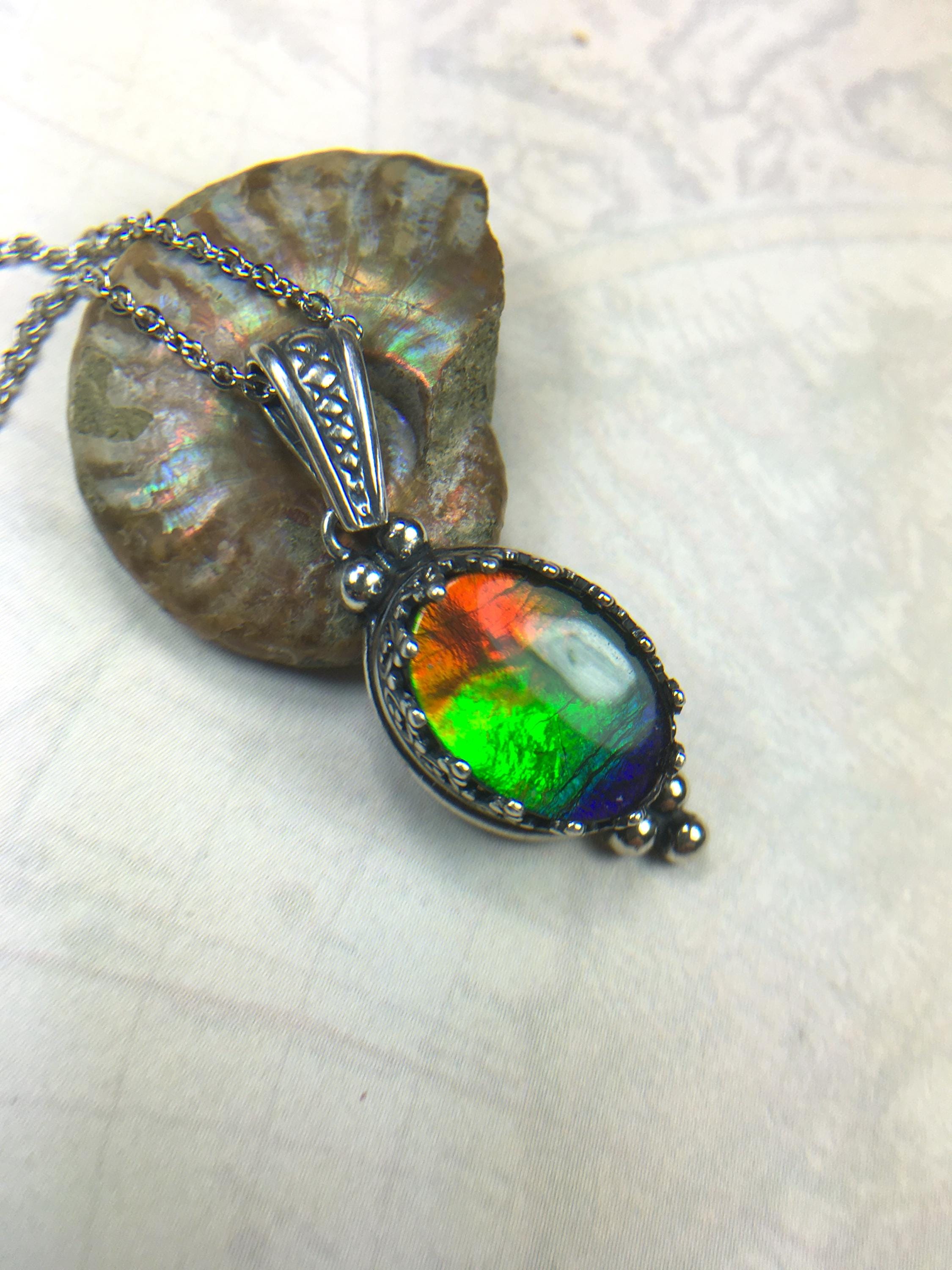 Genuine Ammolite Jewelry Pendant.Rainbow gem.Sterling Silver setting.No import taxes under CUSMA rules.062815