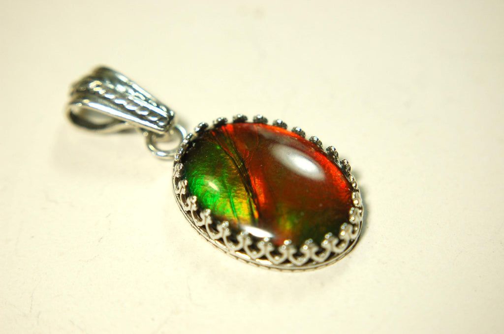 Ammolite Pendant Necklace.Resembles a fiery coal.Strong color shifter.Duty free under CUSMA rules.022115