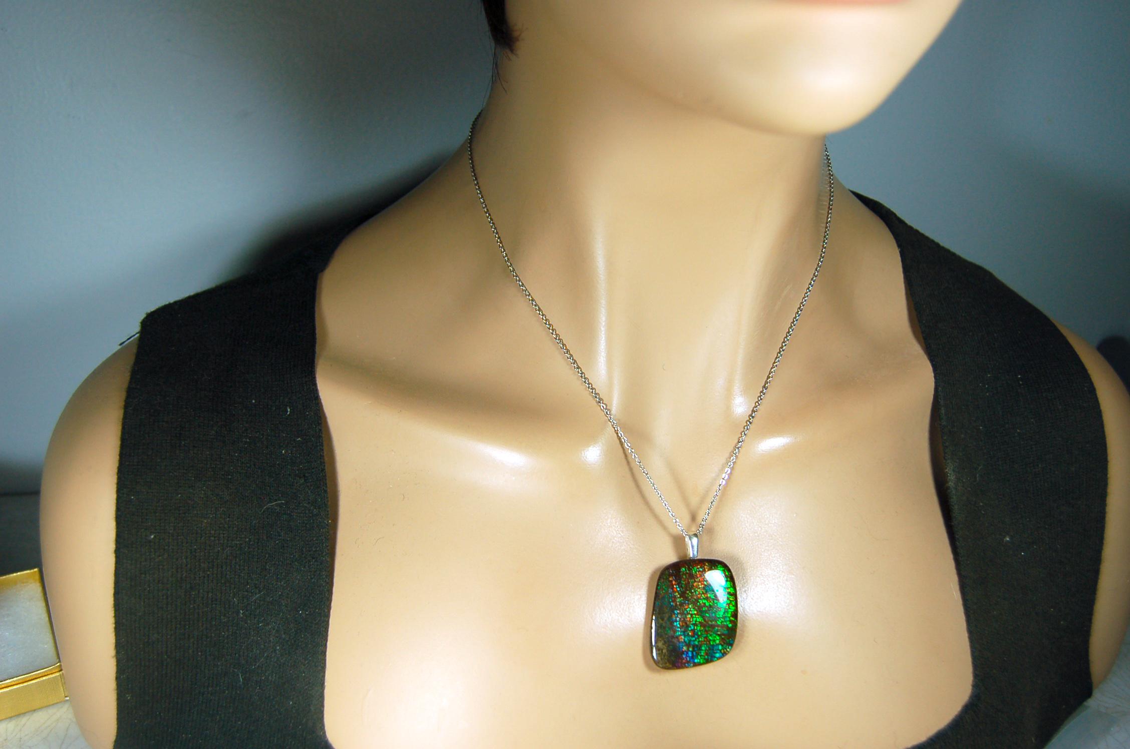 Ammolite Pendant Necklace.RARE Natural gem with brilliant sparks of color on black background.--071815