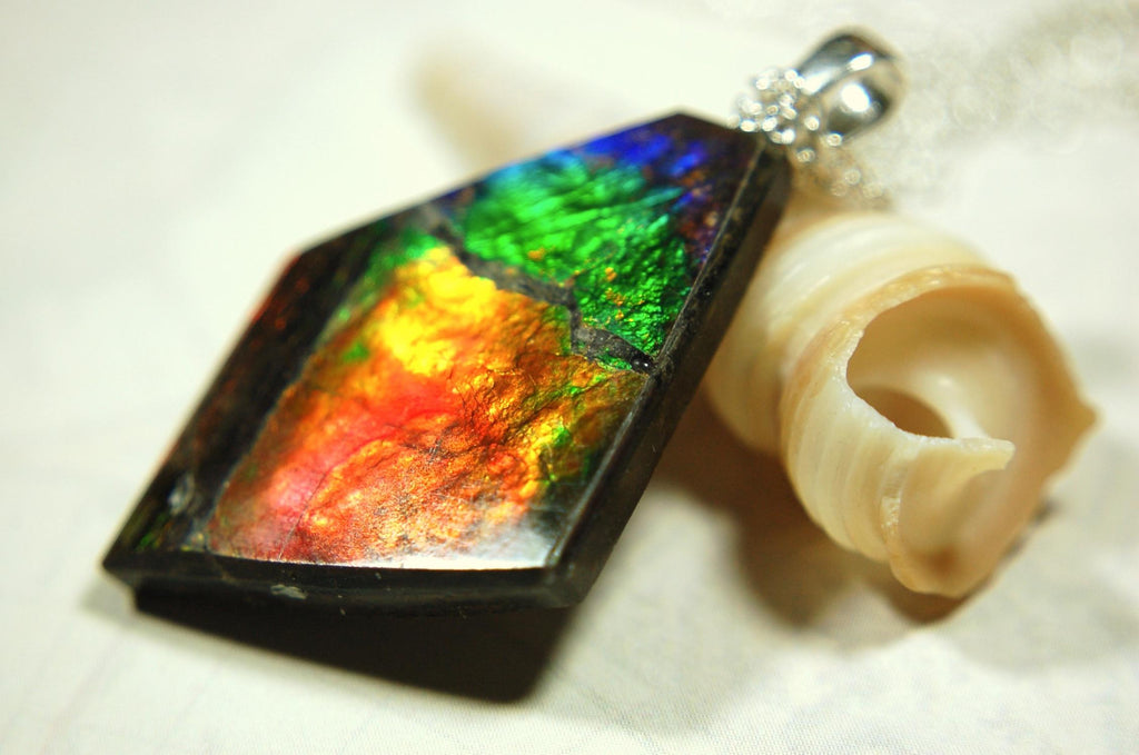 Ammolite pendant necklace.Unique raw natural cabochon with brilliant varied colors.Unisex design.Boho jewelry.031716